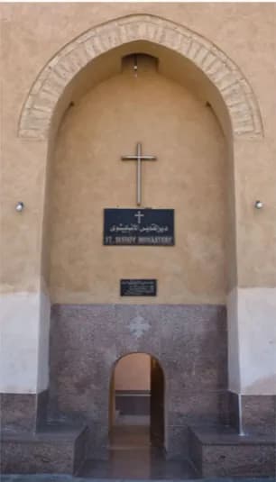 Monk in monastery archway